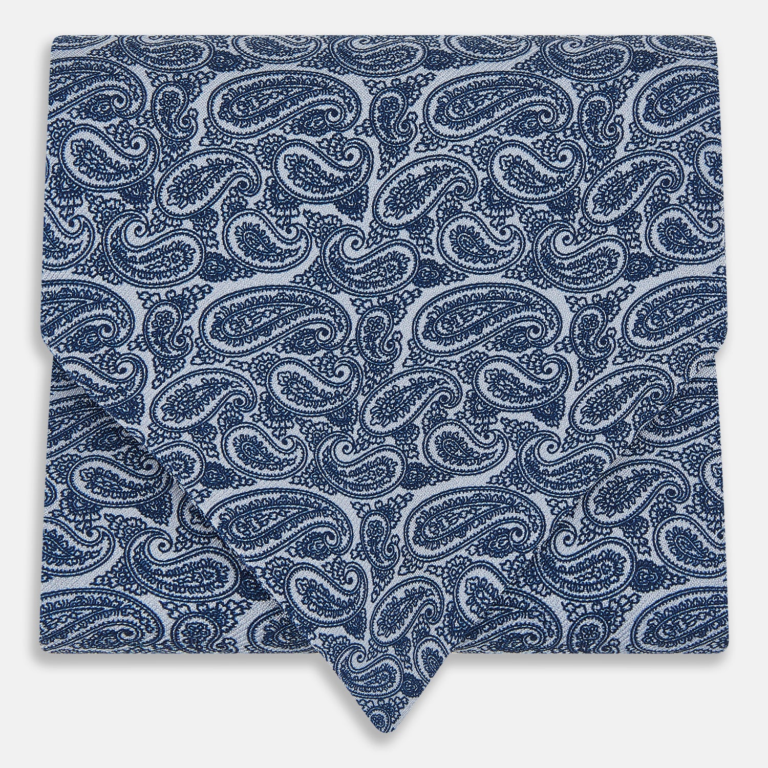Image 1 of product The Pale Blue Paisley Silk Cravat by Turnbull & Asser showcases intricate, swirling blue and white paisley designs on a light background, echoing the elegance of British style accessories.