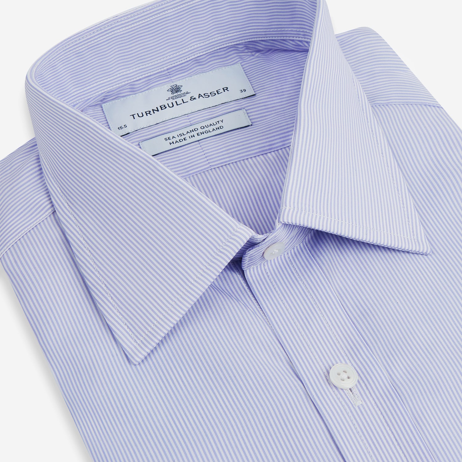 Image 2 of product A Blue and White Fine Bengal Stripe Sea Island Quality Cotton Shirt by Turnbull & Asser, featuring a T&A collar and 3-button cuffs, is laid flat on a white background.