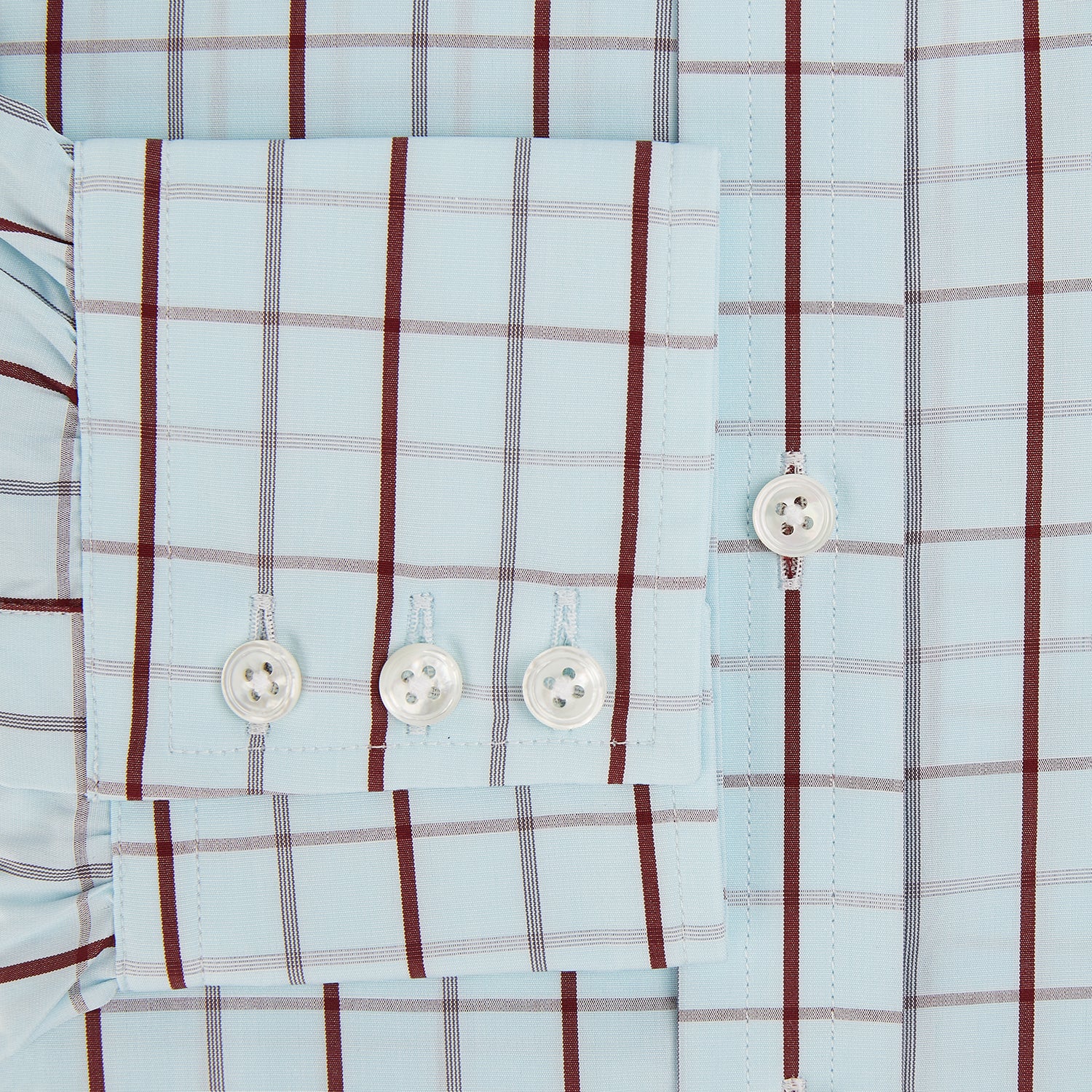 Image 4 of product The Turnbull & Asser Burgundy Combination Check Mayfair Shirt is a long-sleeve button-up dress shirt with a check pattern, ideal for formal wear and shown on a plain white background.