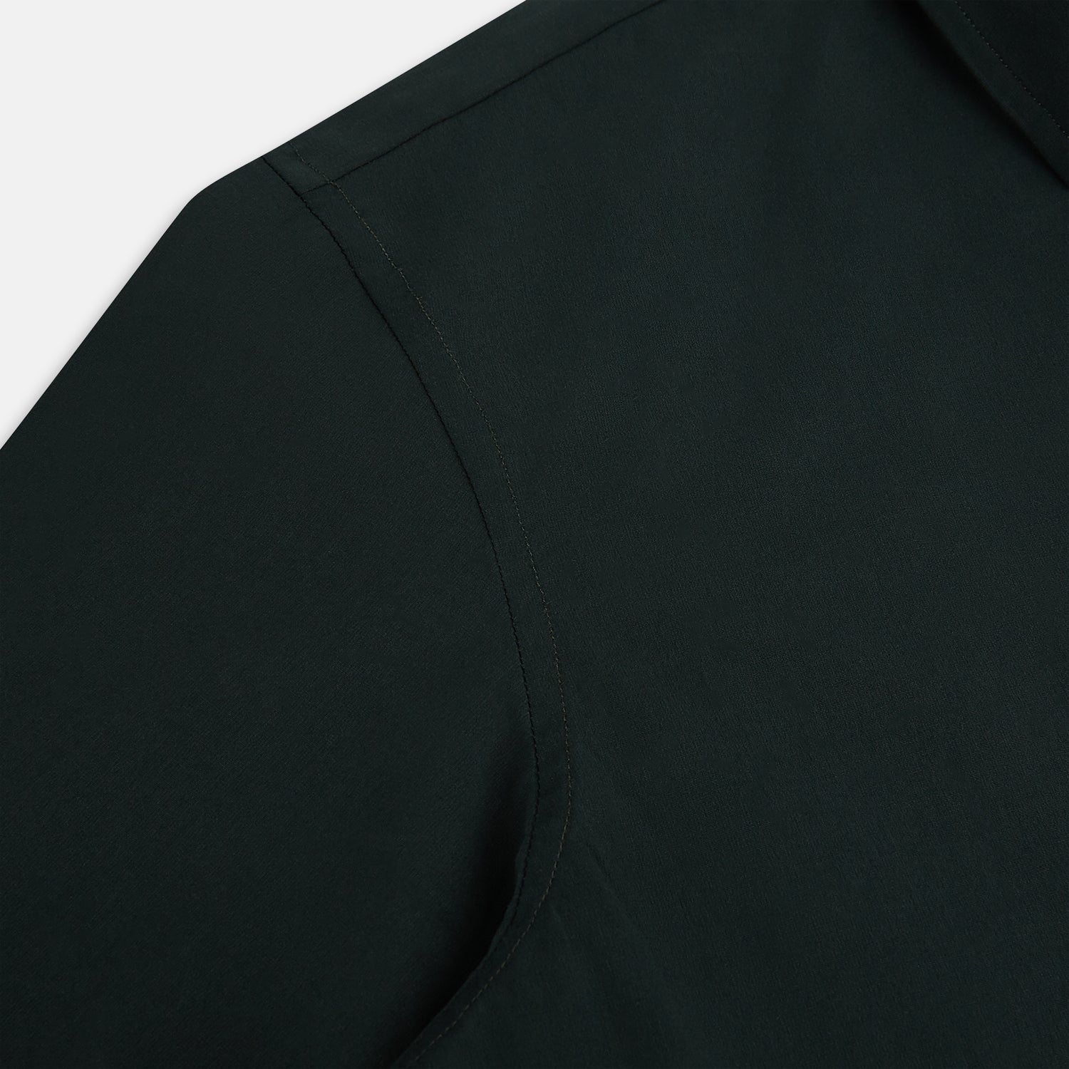 Image 6 of product The FOREST GREEN WINDSOR SHIRT by Turnbull & Asser features long sleeves, a Windsor collar, and buttoned cuffs, reflecting British craftsmanship. Displayed on a plain white background.