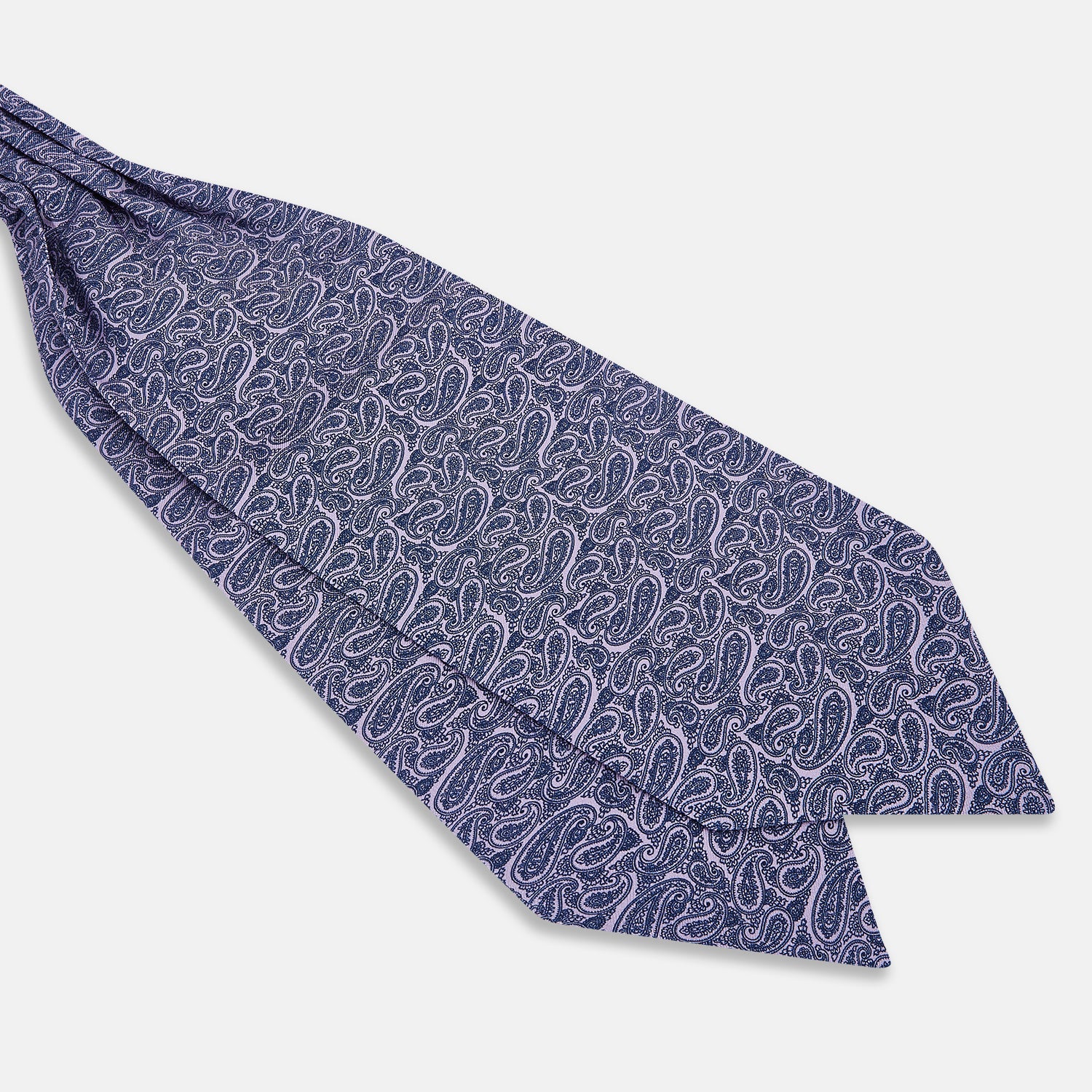 Image 3 of product The Turnbull & Asser Lilac Paisley Silk Cravat showcases British elegance with its dark blue paisley pattern on a lilac background, beautifully displayed on a white surface.