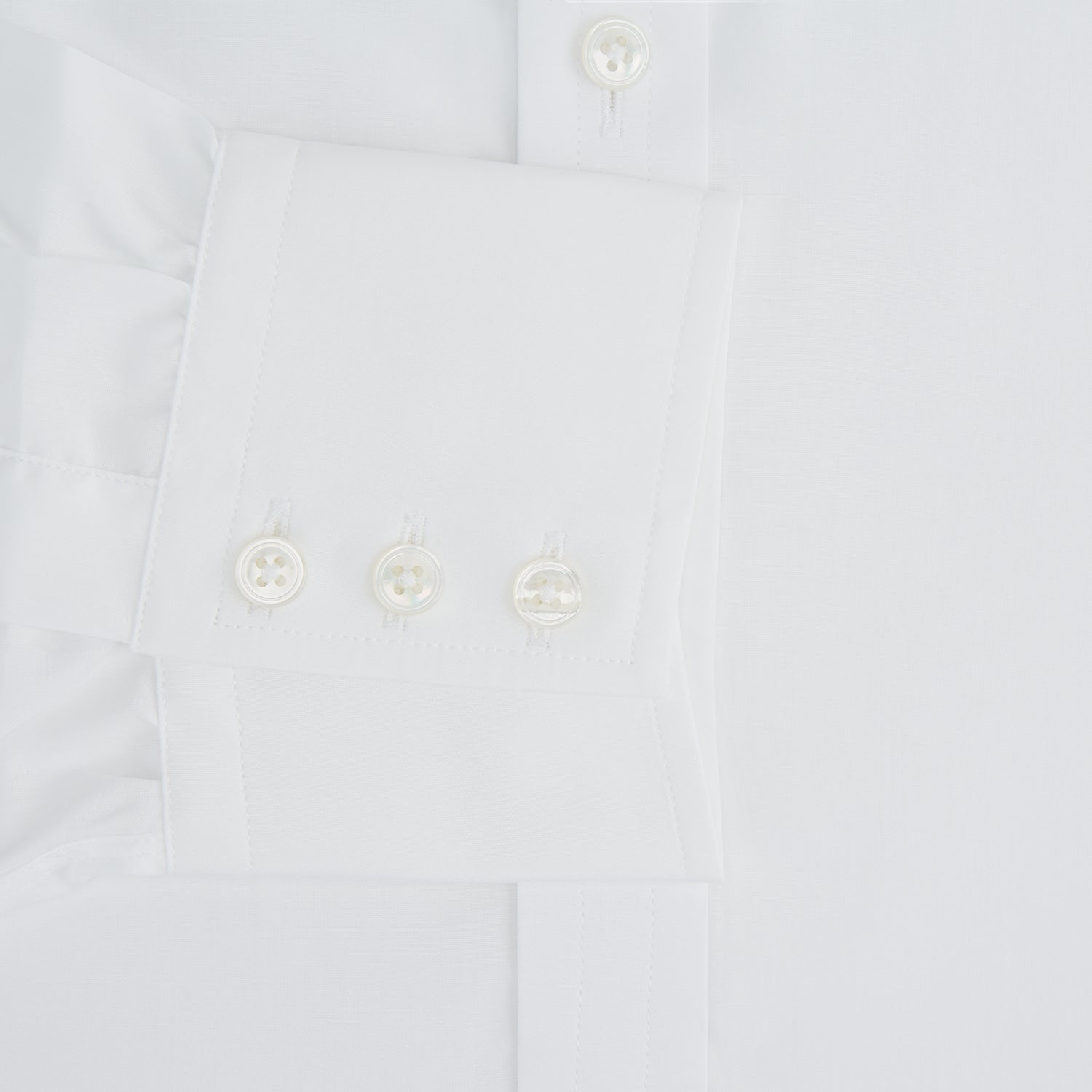 Image 4 of product The Turnbull & Asser White Sea Island Quality Cotton Shirt features a T&A collar and 3-button cuffs, crafted from luxurious cotton and displayed on a white background.