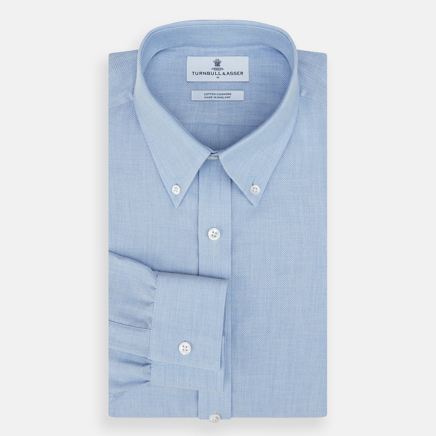 Image 4 of product The Turnbull & Asser Pale Blue Cotton Cashmere Dorset Collar Richmond Shirt features long sleeves, a button-down collar, white buttons, and a chest pocket. It is neatly displayed flat on a white background.