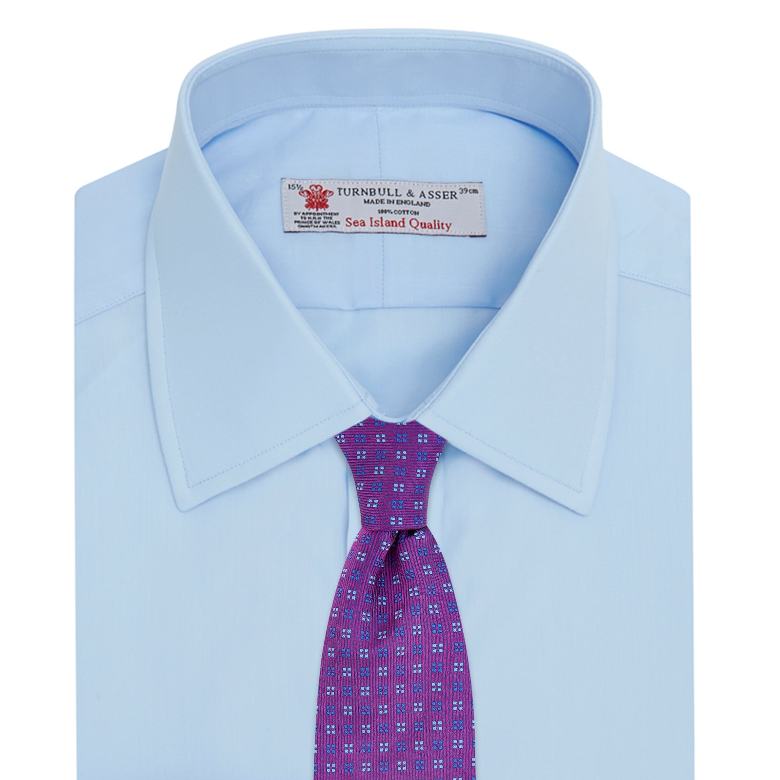 Image 4 of product The Turnbull & Asser Light Blue Sea Island Quality Cotton Shirt features a T&A collar, double cuffs, white buttons, and a quality label inside the collar. Displayed on a plain white background.