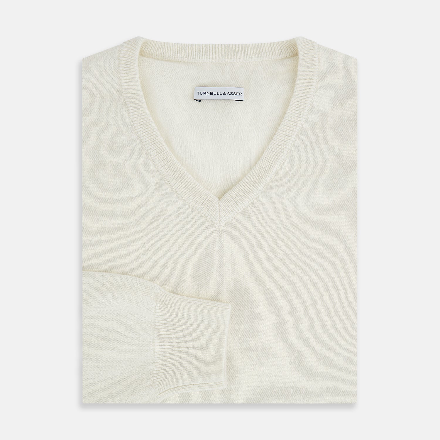 Image 4 of product The Turnbull & Asser White Cashmere V-Neck Jumper features long sleeves and a versatile light cream shade, making it a timeless addition to your knitwear collection.