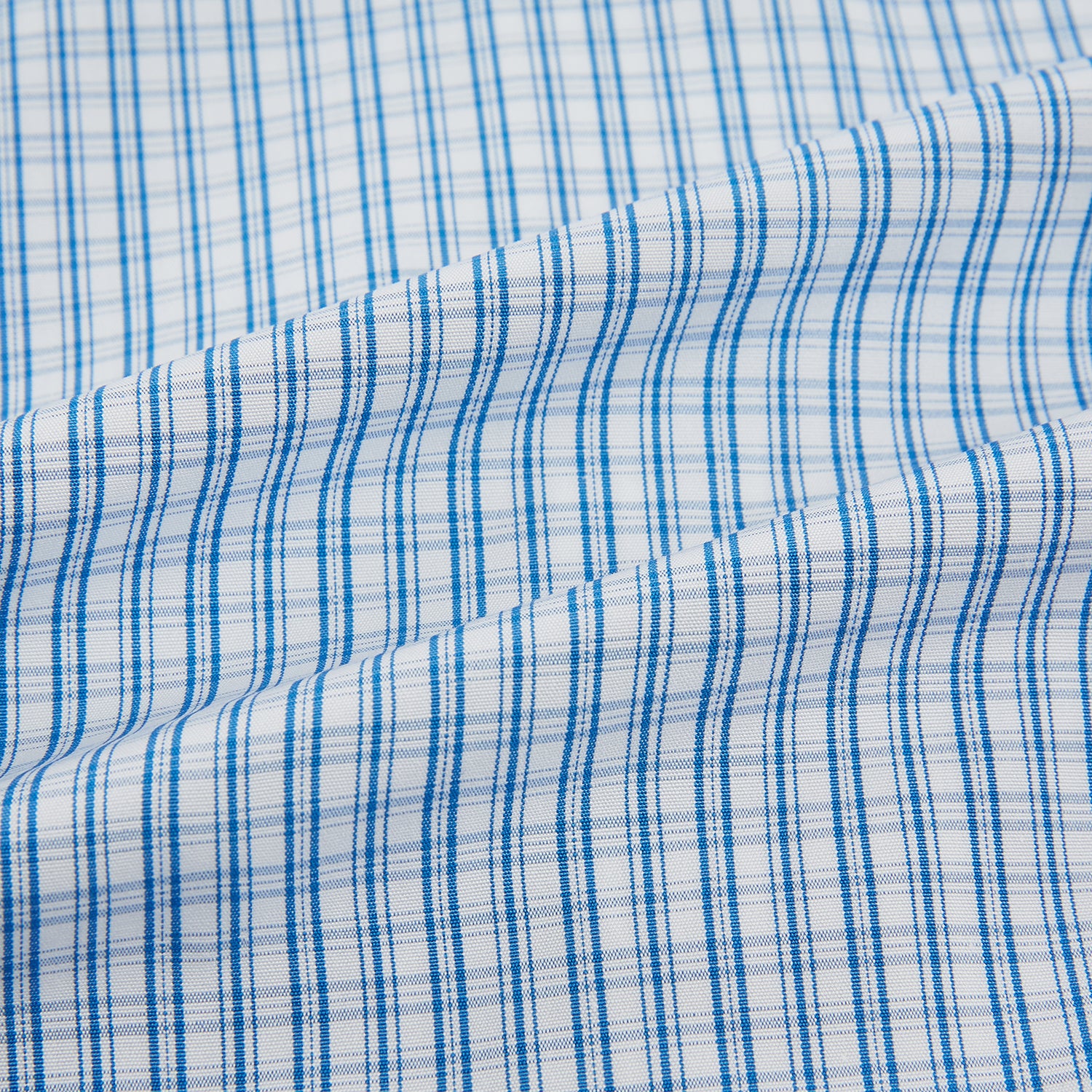 Image 6 of product The Sky Blue Micro Graph Check Mayfair Shirt by Turnbull & Asser features a classic T&A collar, button-down front, and buttoned cuffs, shown laid flat on a white background.