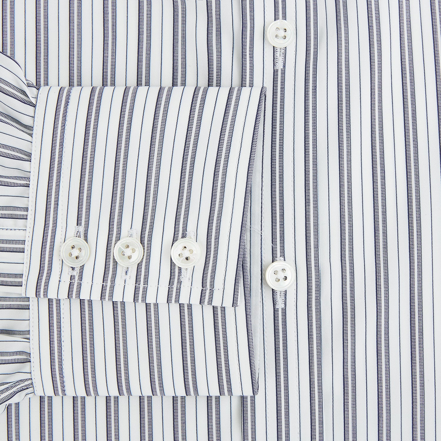 Image 4 of product The Turnbull & Asser Navy Multi Stripe Mayfair Shirt, a pure cotton button-up with long sleeves and a collar, features thin vertical blue and white stripes and is displayed flat on a white background.