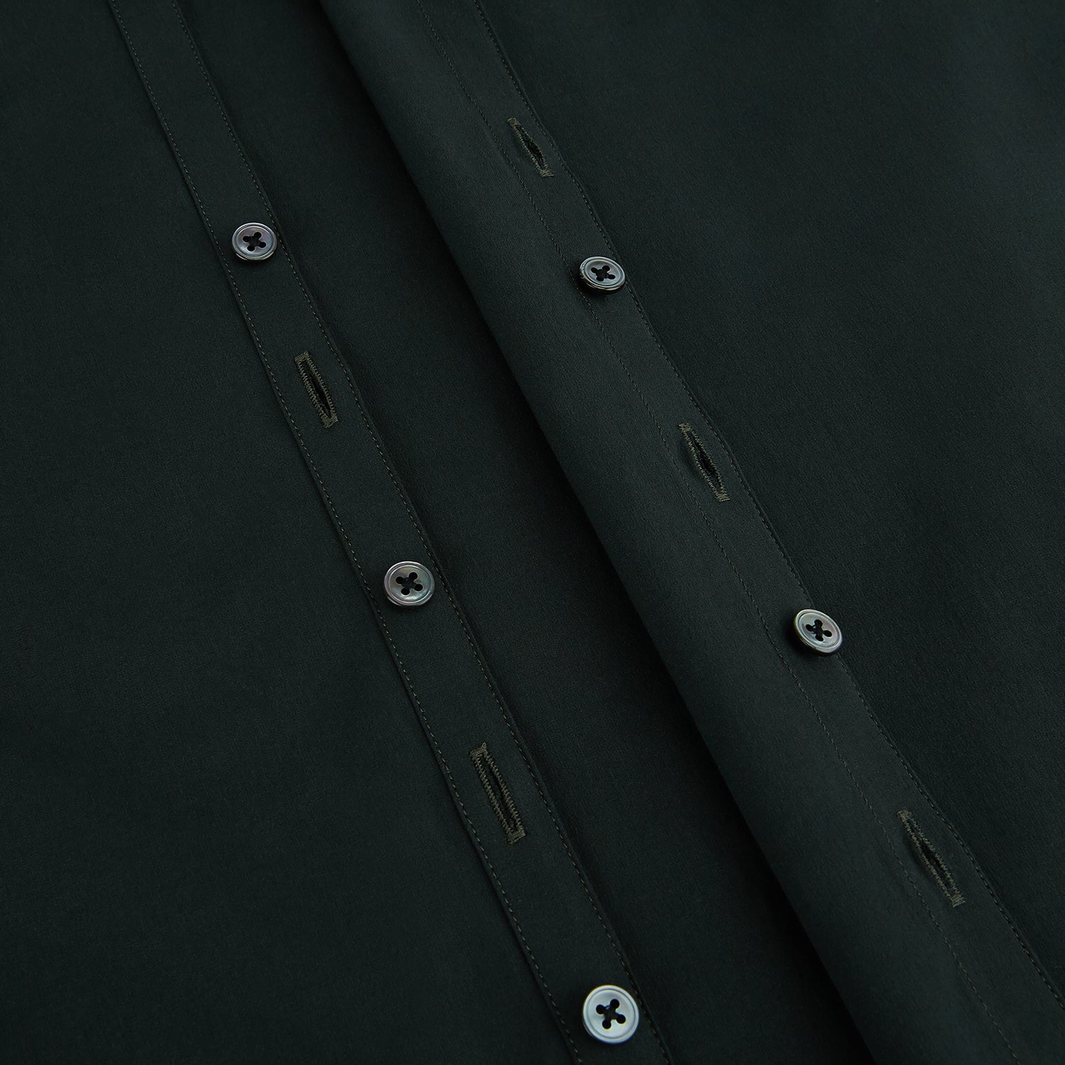 Image 7 of product The FOREST GREEN WINDSOR SHIRT by Turnbull & Asser features long sleeves, a Windsor collar, and buttoned cuffs, reflecting British craftsmanship. Displayed on a plain white background.