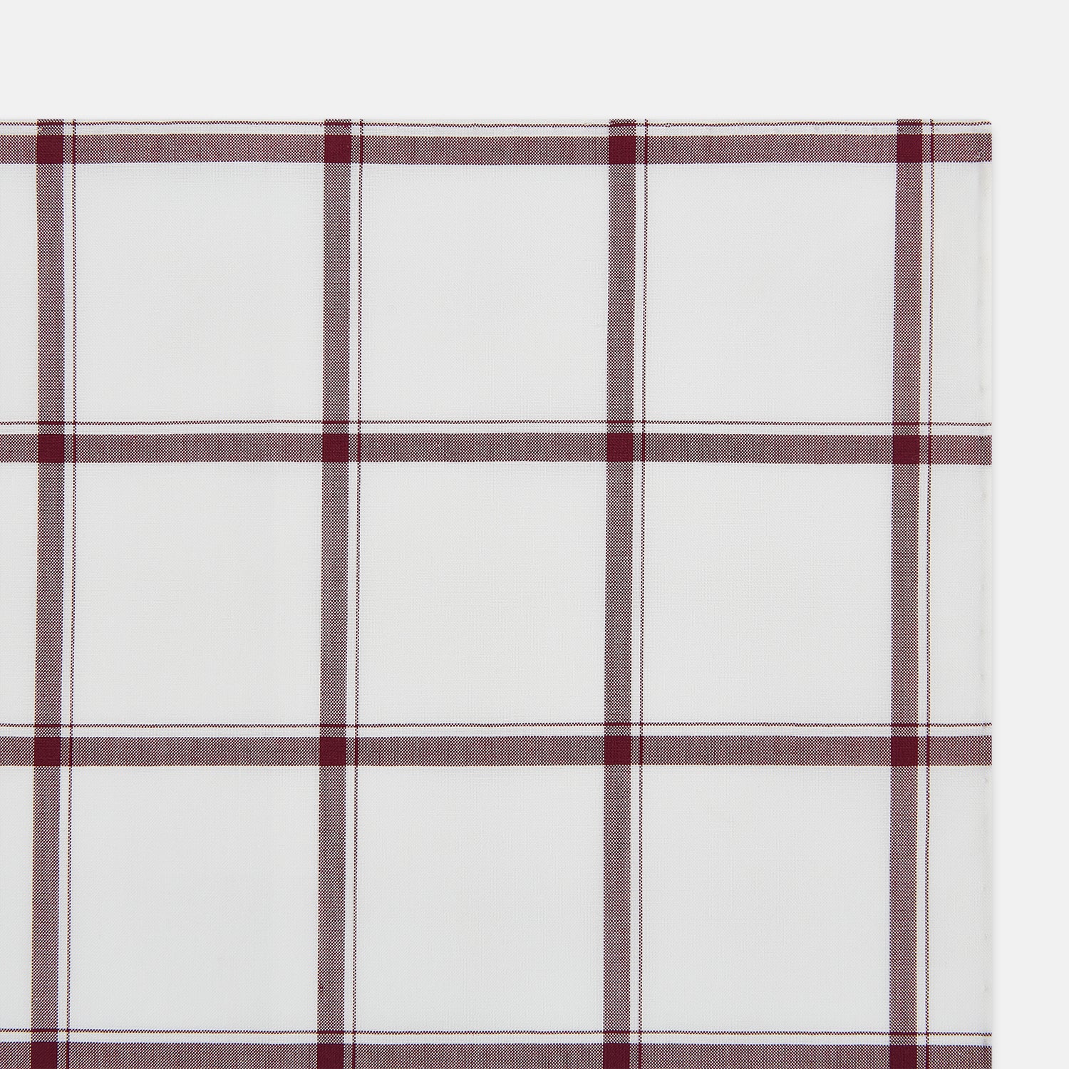Image 2 of product The Turnbull & Asser Burgundy Grid Check Hand-Rolled Handkerchief features a white base with burgundy grid lines forming large squares and is finished with elegant hand-rolled edges.