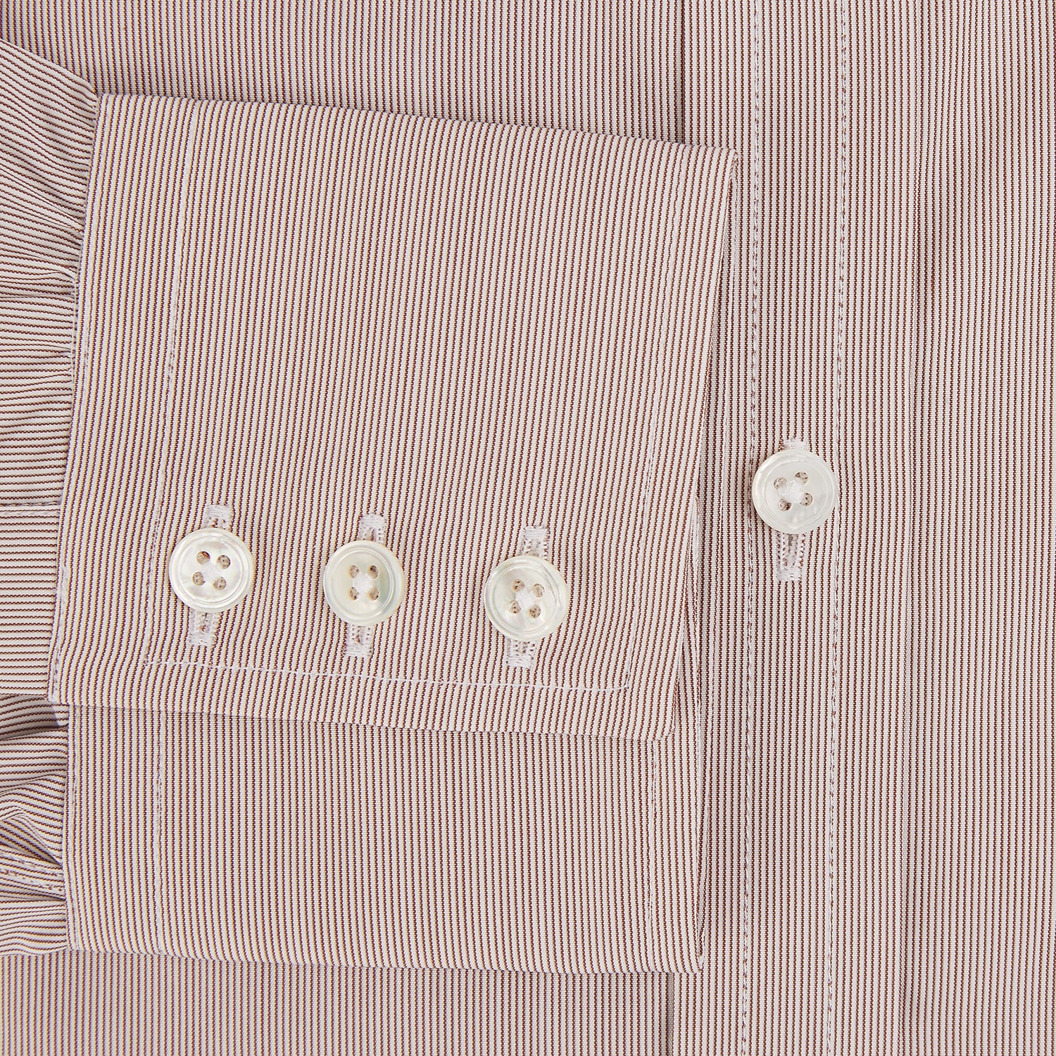 Image 4 of product The Turnbull & Asser Burgundy Hairline Stripe Mayfair Shirt features long sleeves, a pointed collar, white buttons, and a classic Mayfair fit—perfect for formal occasions—presented against a plain white background.