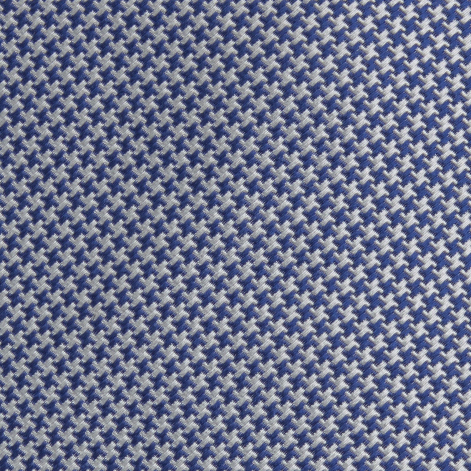 Image 3 of product The Turnbull & Asser Blue Houndstooth Silk Tie features a classic blue and white pattern, rolled and displayed on a white background—an elegant accessory for your favorite office shirt.