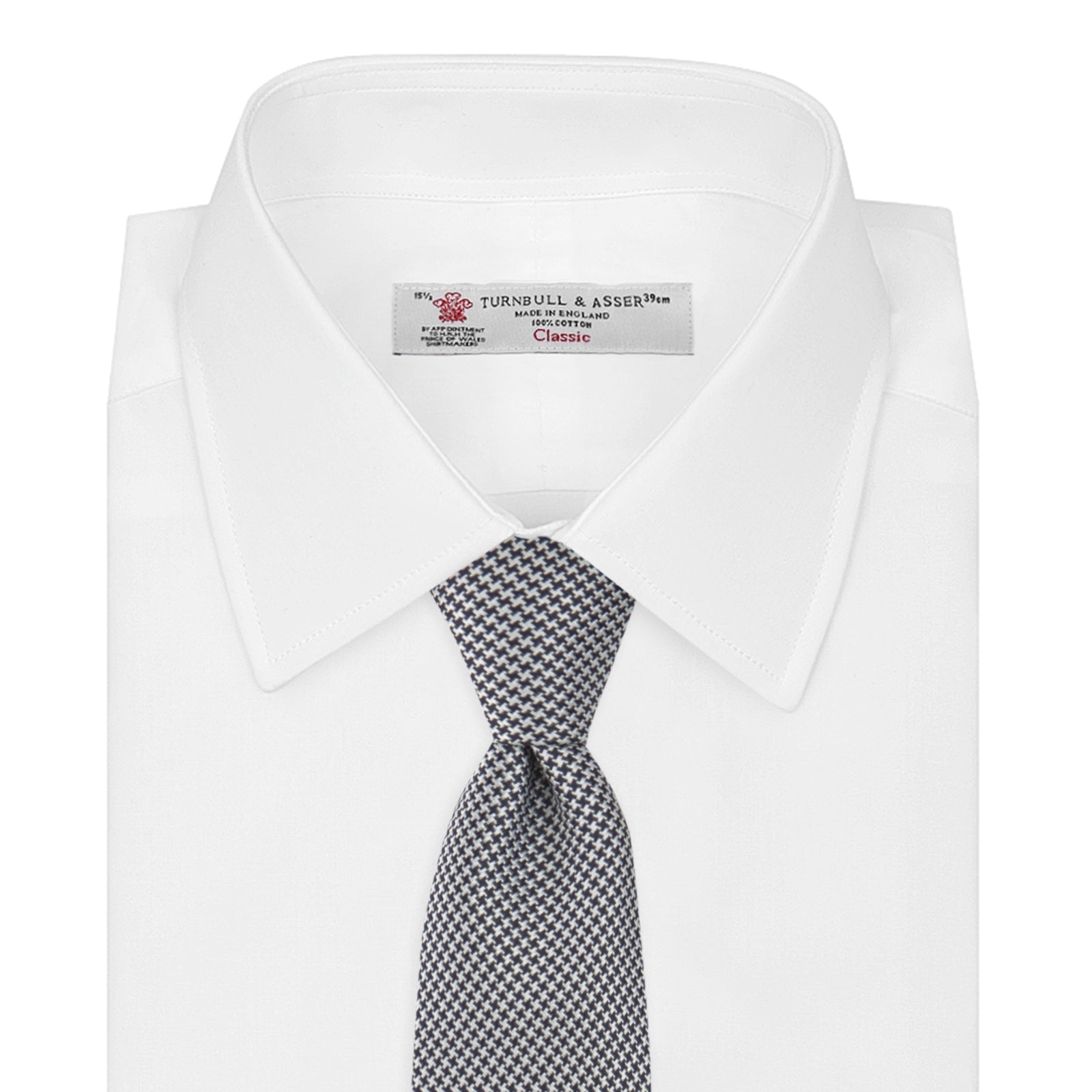 Image 2 of product The Turnbull & Asser Navy Houndstooth Silk Tie features a refined small houndstooth pattern in navy, elegantly rolled and showcased on a white background.