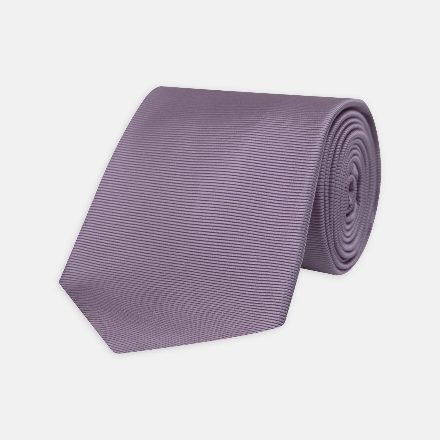 Image 1 of product The Lilac Horizontal Twill Silk Tie by Turnbull & Asser features a subtle ribbed texture and neat roll, shown on a white background—an ideal accessory for any cotton shirt.