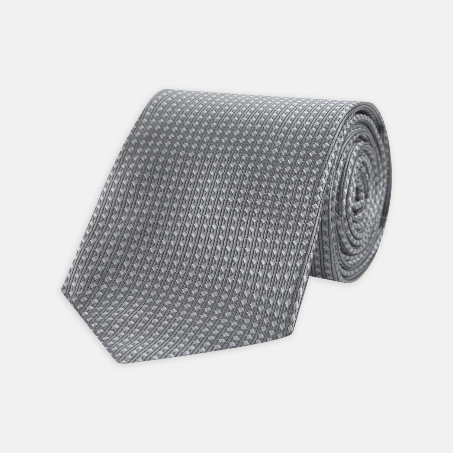 Image 1 of product The Turnbull & Asser Grey and White Diamond Silk Tie, featuring a subtle textured pattern, is perfect for pairing with an office shirt and is displayed against a white background.
