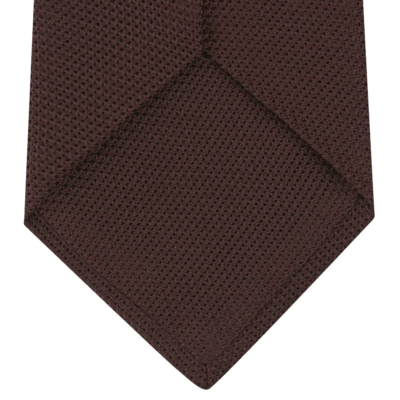 Image 4 of product The Turnbull & Asser Burgundy Grenadine Silk Tie, featuring a textured grenadine weave, is rolled up and displayed against a plain white background.