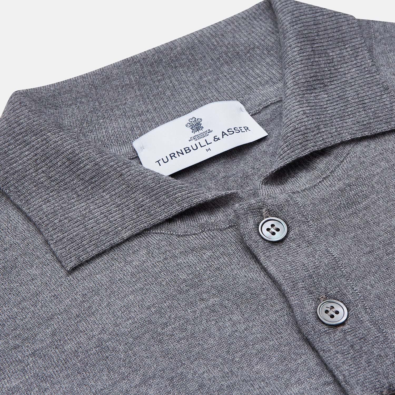 Image 2 of product The Grey Merino Wool Cecil Rugby Polo Shirt by Turnbull & Asser features long sleeves, a collar, three-button placket, and ribbed hem and cuffs—an elevated menswear staple shown flat on a white background.
