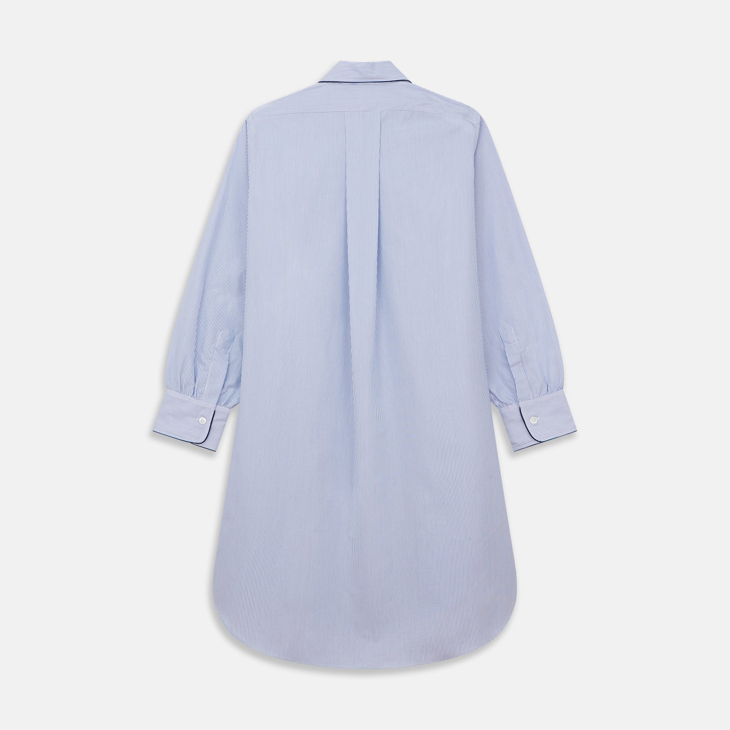 Image 5 of product The Turnbull & Asser Blue Fine Bengal Stripe Piped Cotton Nightshirt features long sleeves, a chest pocket, black collar piping, curved hem, and side slits. It is displayed laid flat on a white background.