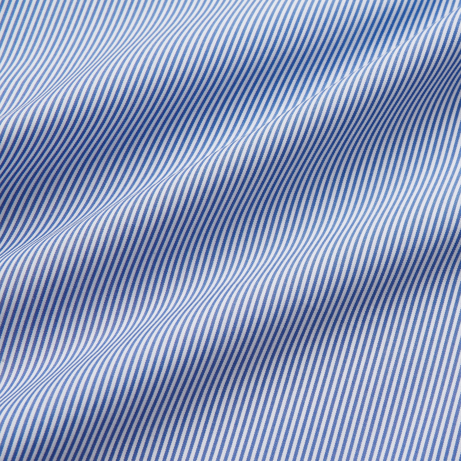 Image 4 of product The Turnbull & Asser Blue Fine Bengal Stripe Piped Cotton Nightshirt features long sleeves, a chest pocket, black collar piping, curved hem, and side slits. It is displayed laid flat on a white background.
