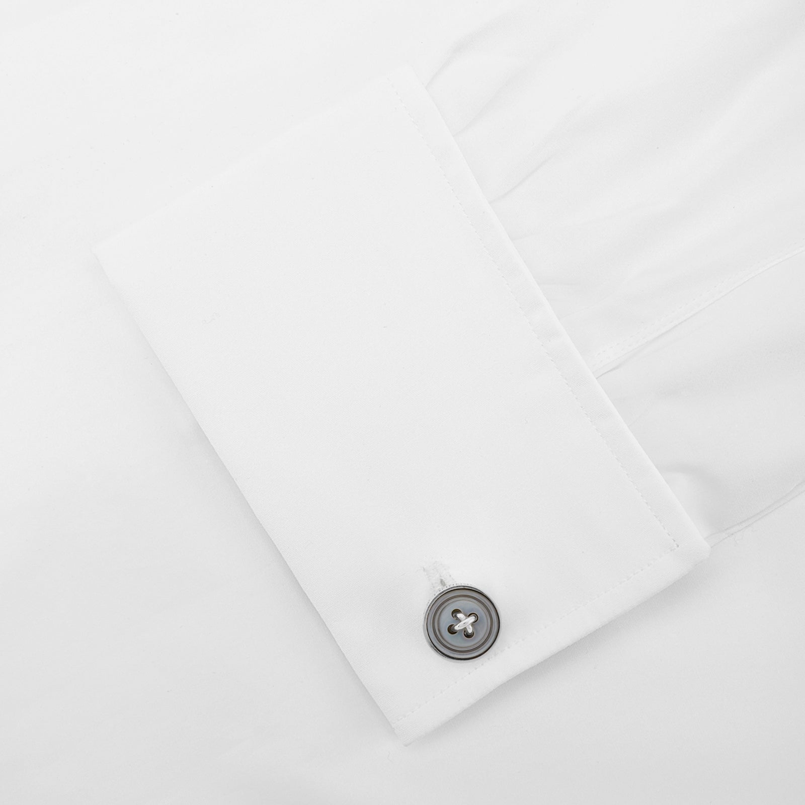 Image 3 of product Turnbull & Asser's Smoke Sterling Silver Mother-of-Pearl Button Cufflinks feature a round, button-inspired design with a dark iridescent center and four holes, showcasing British style against a plain white background.