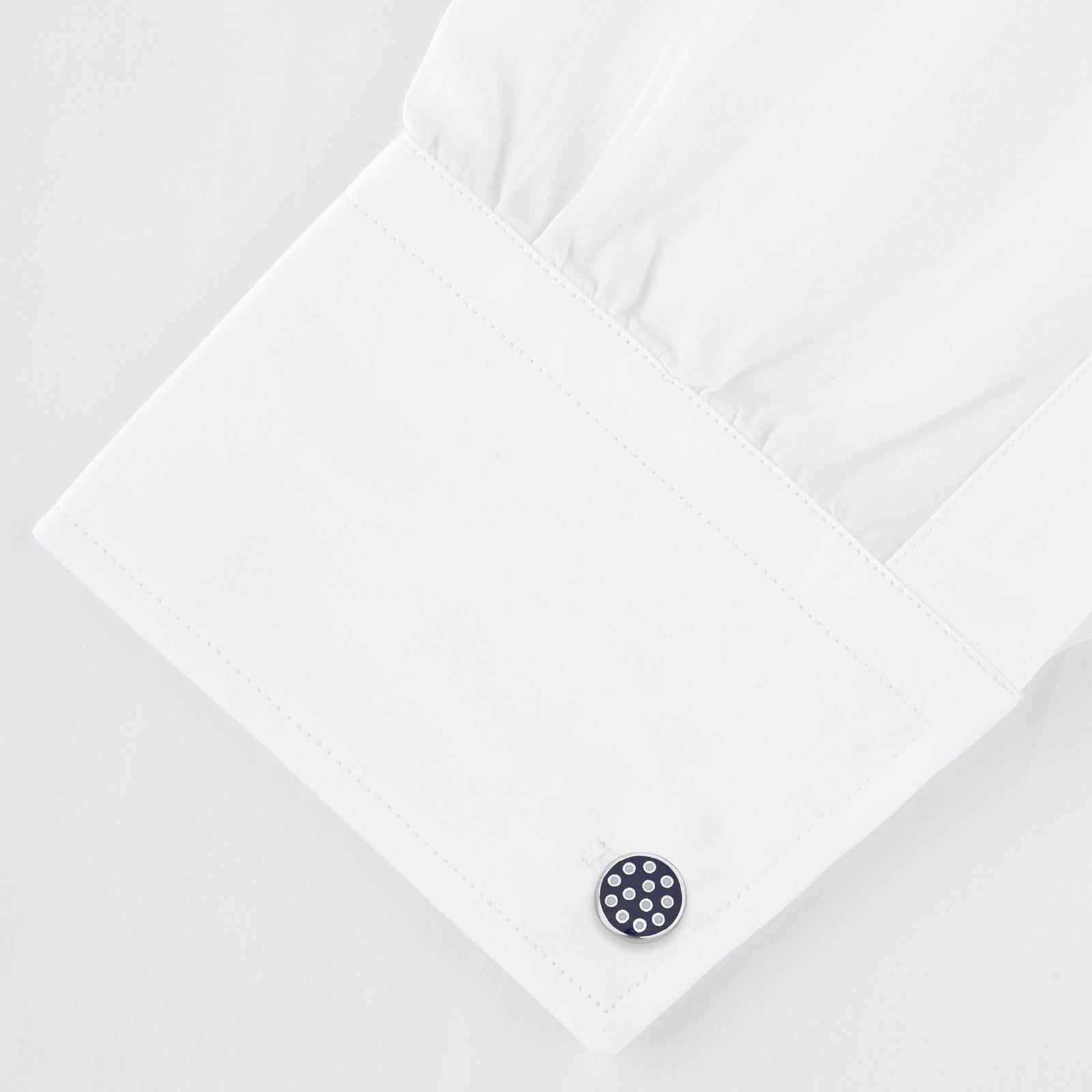 Image 4 of product The Spotted Navy and White Sterling Silver Enamelled Cufflinks by Turnbull & Asser feature a navy enamel face with evenly spaced silver dots, making them a smart finishing touch for any outfit.
