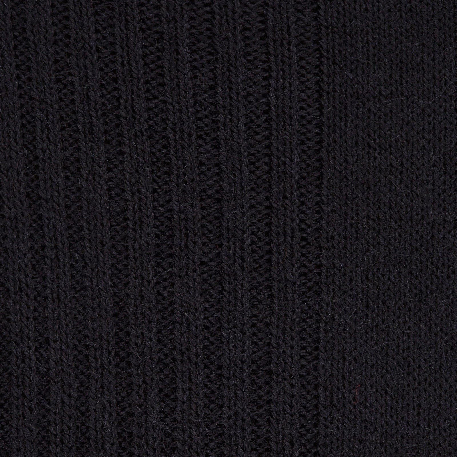 Image 2 of product A single Turnbull & Asser Black Mid-Length Merino Wool Sock stands upright and slightly angled to the left against a plain white background—an ideal men's dress sock choice.