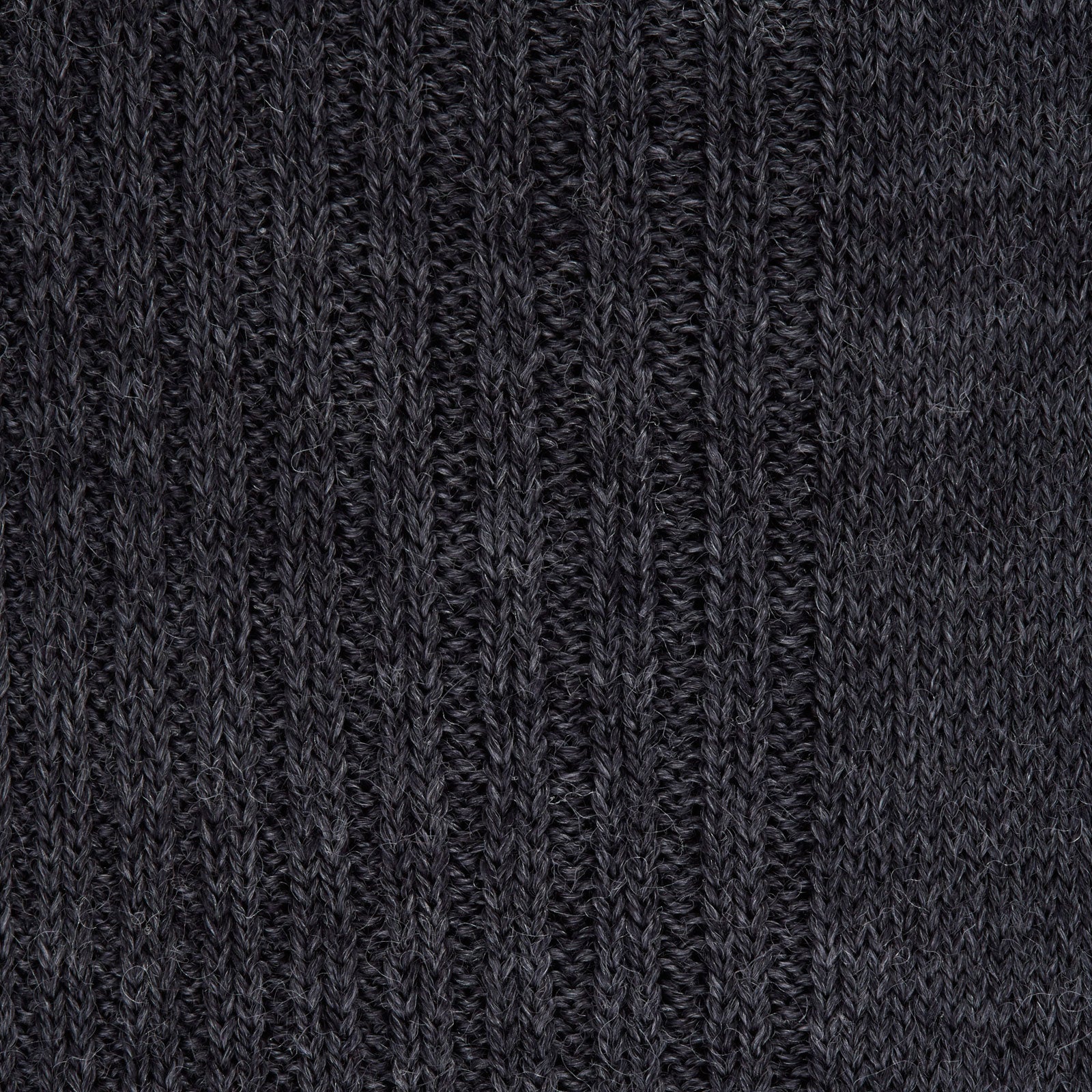 Image 2 of product The Turnbull & Asser Dark Grey Mid-Length Merino Wool Sock, ideal as a men’s dress sock, is showcased upright against a plain light gray background.