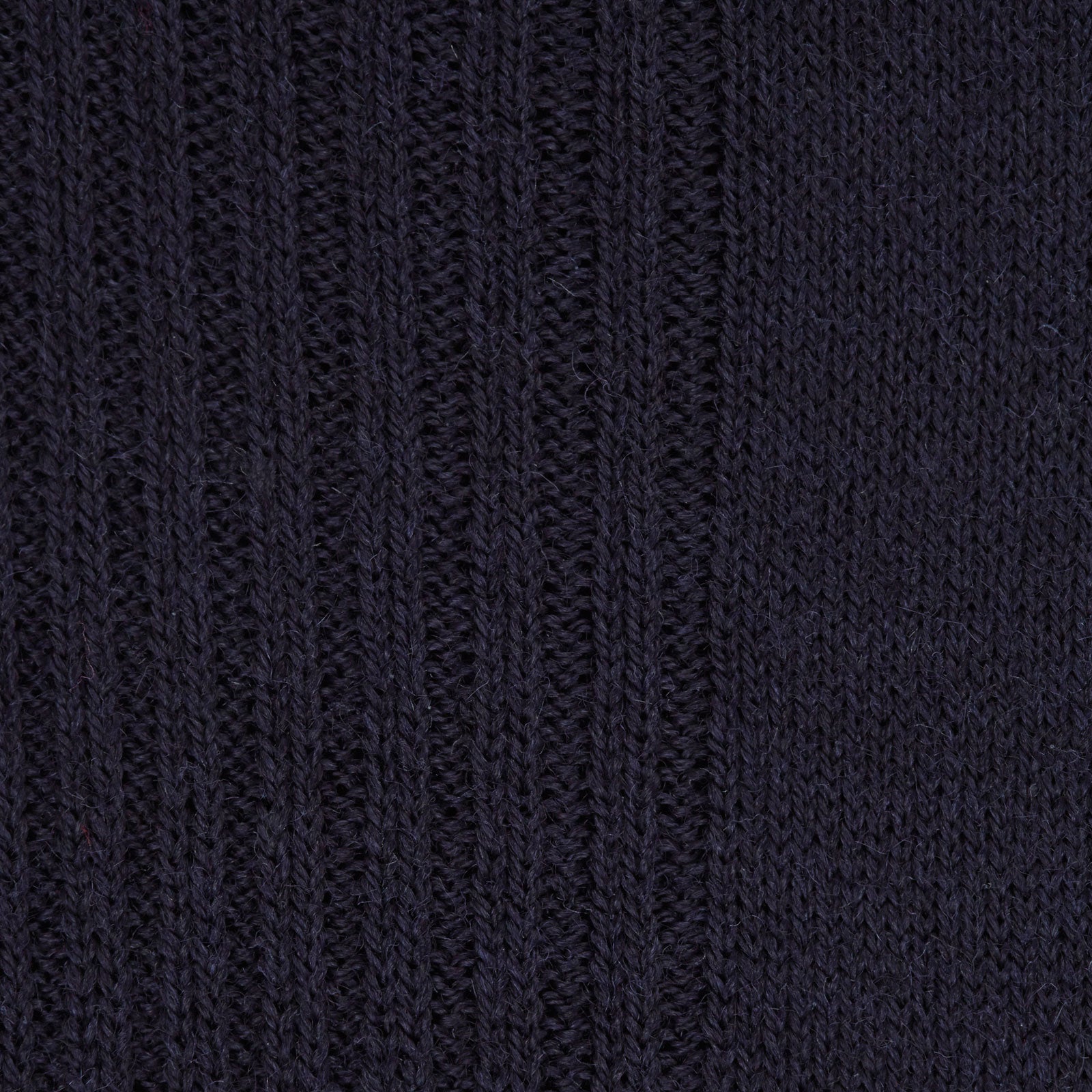 Image 2 of product A single Deep Navy Mid-Length Merino Wool Sock from Turnbull & Asser stands upright on a white background, showcasing the comfort and timeless style characteristic of luxury men's socks.