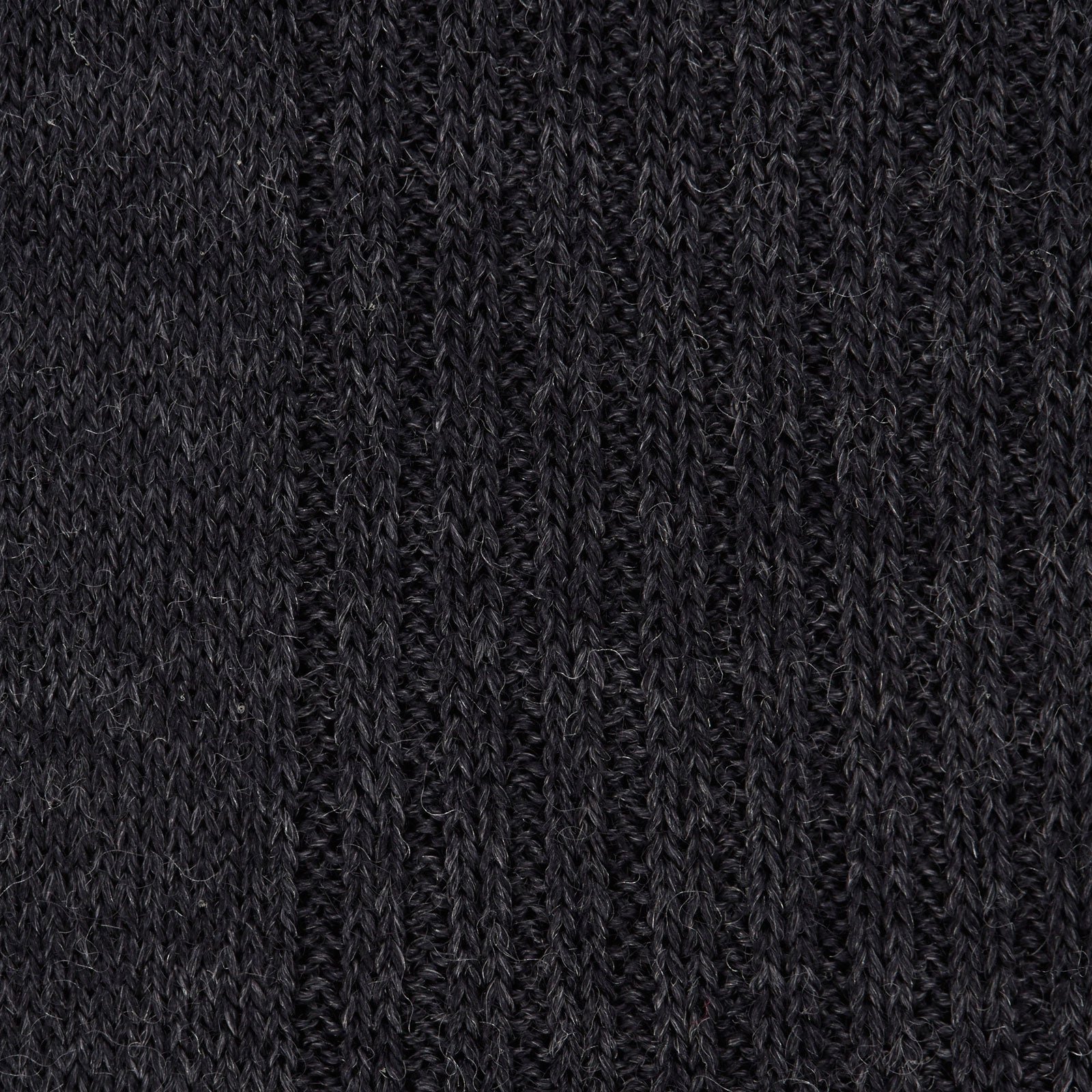 Image 2 of product A single Charcoal Long Merino Wool Sock by Turnbull & Asser is shown upright on a white background. Featuring a ribbed texture and snug fit, these luxury men's socks blend style with comfort.
