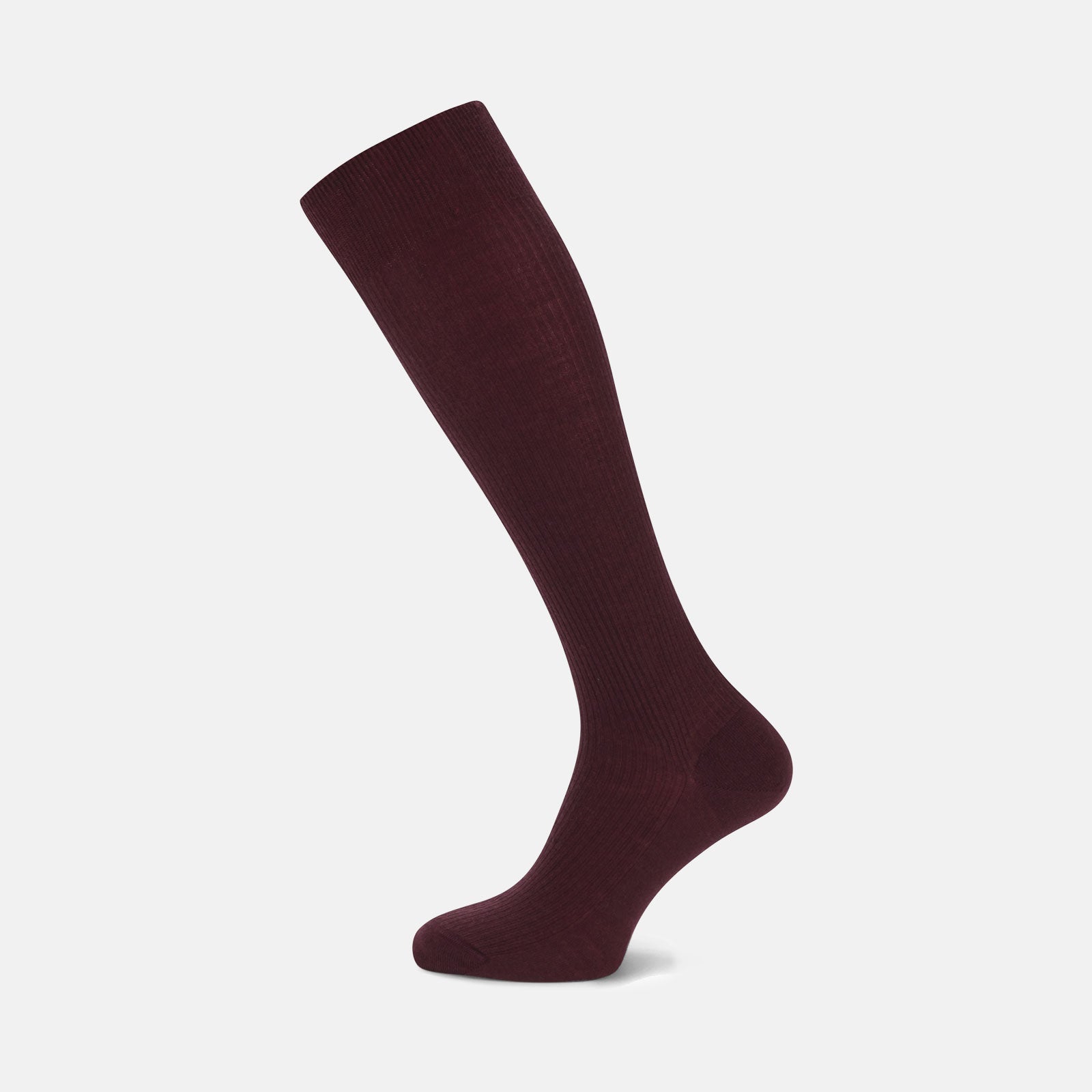 Image 1 of product Turnbull & Asser’s Maroon Long Merino Wool Sock stands upright on a white background, highlighting its ribbed texture and snug fit—ideal for those seeking luxury, comfort, and style.