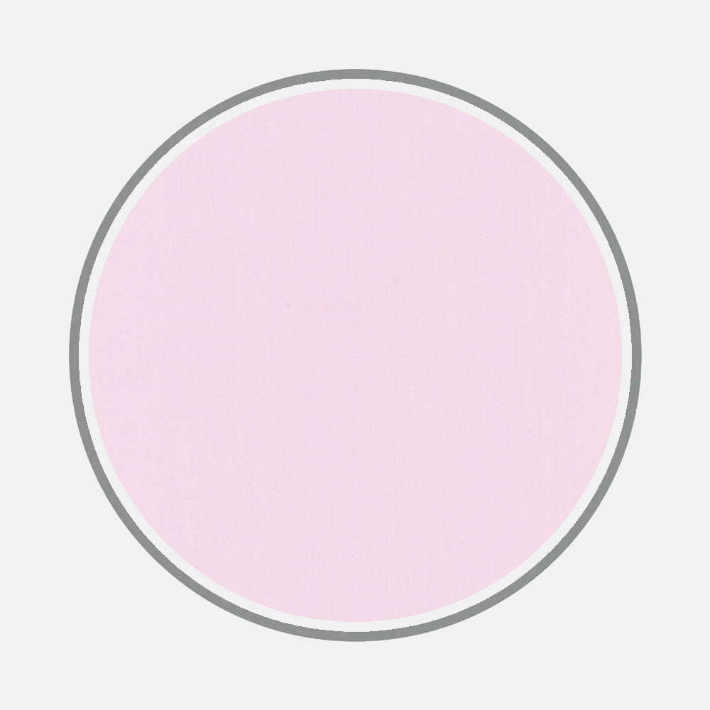 A large, light pink circle with a thin white and gray border on a plain light gray background—ideal for presenting Turnbull & Asser’s Bespoke Fabric 0020 15 or exploring custom shirt options with elegant monogram styles.