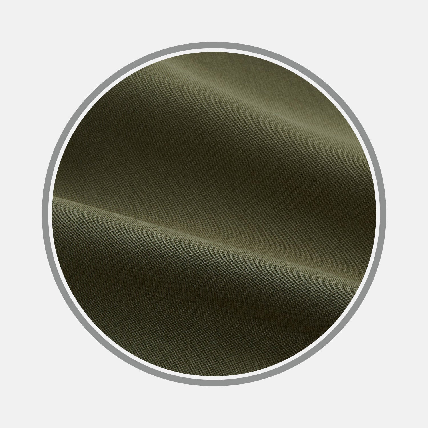 View 1 of product Close-up of BESPOKE FABRIC 0033 47 by Turnbull & Asser: olive green fabric with a smooth texture, soft folds, and gentle shadows, ideal for custom shirts. Displayed in a circular frame on a light gray background.