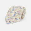 View 1 of product A rolled-up Cream Multi Bloomsbury-Inspired Pattern Silk Tie by Turnbull & Asser, featuring a pastel floral and paisley design in green, blue, pink, and orange tones, displayed on a white background.