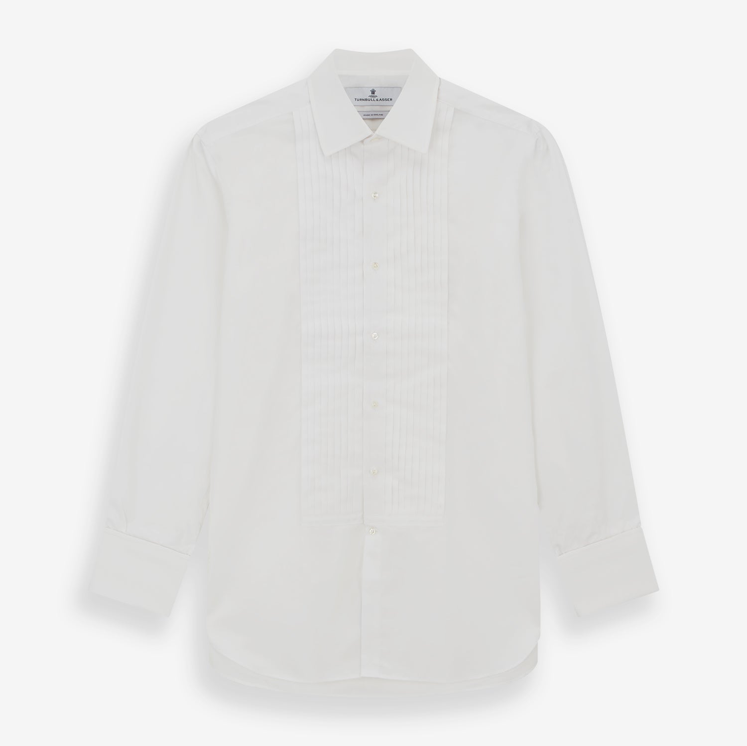 View 1 of product The Turnbull & Asser White Pleated Cotton Dress Shirt features a T&A collar, double cuffs, a button-down front, elegant chest pleats, and a slightly curved hem for a classic formal look.
