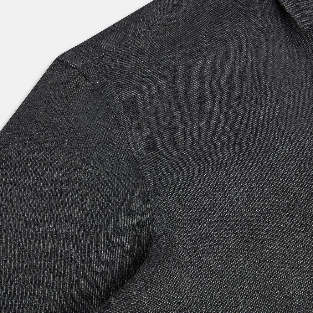 The Ash Linen Windsor Shirt by Turnbull & Asser is a long-sleeve, button-up black shirt with a Windsor collar and cuffs, reflecting British craftsmanship, shown on a plain white background.