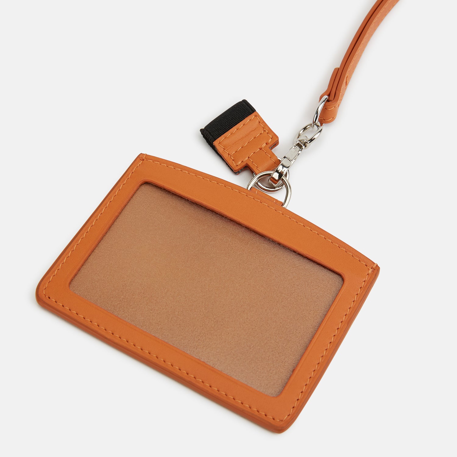 View 3 of product A tan Turnbull & Asser ID Card Holder made of Italian leather, featuring a matching lanyard and small tag. "Turnbull & Asser" is elegantly embossed in gold on the front, set against a plain white background.