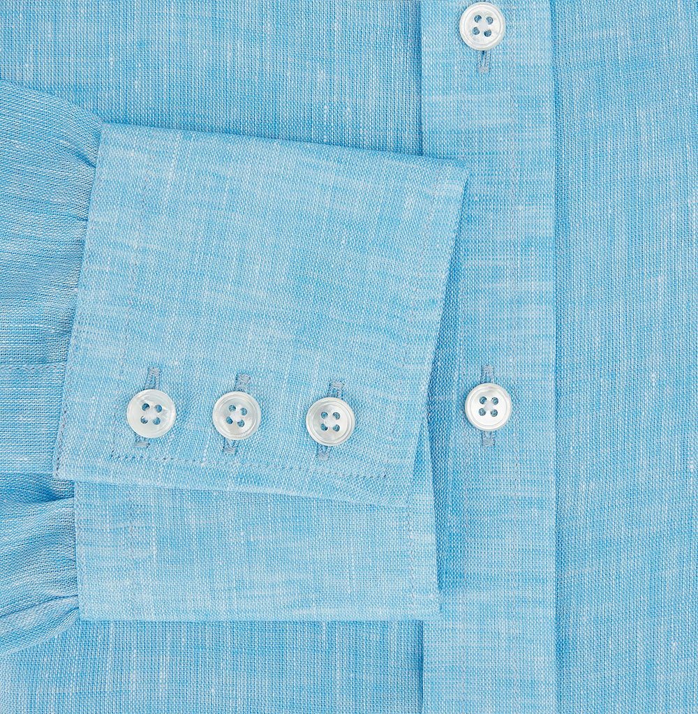 The Turnbull & Asser Turquoise Linen Mayfair Shirt features long sleeves and a collar, displayed neatly on a white background.