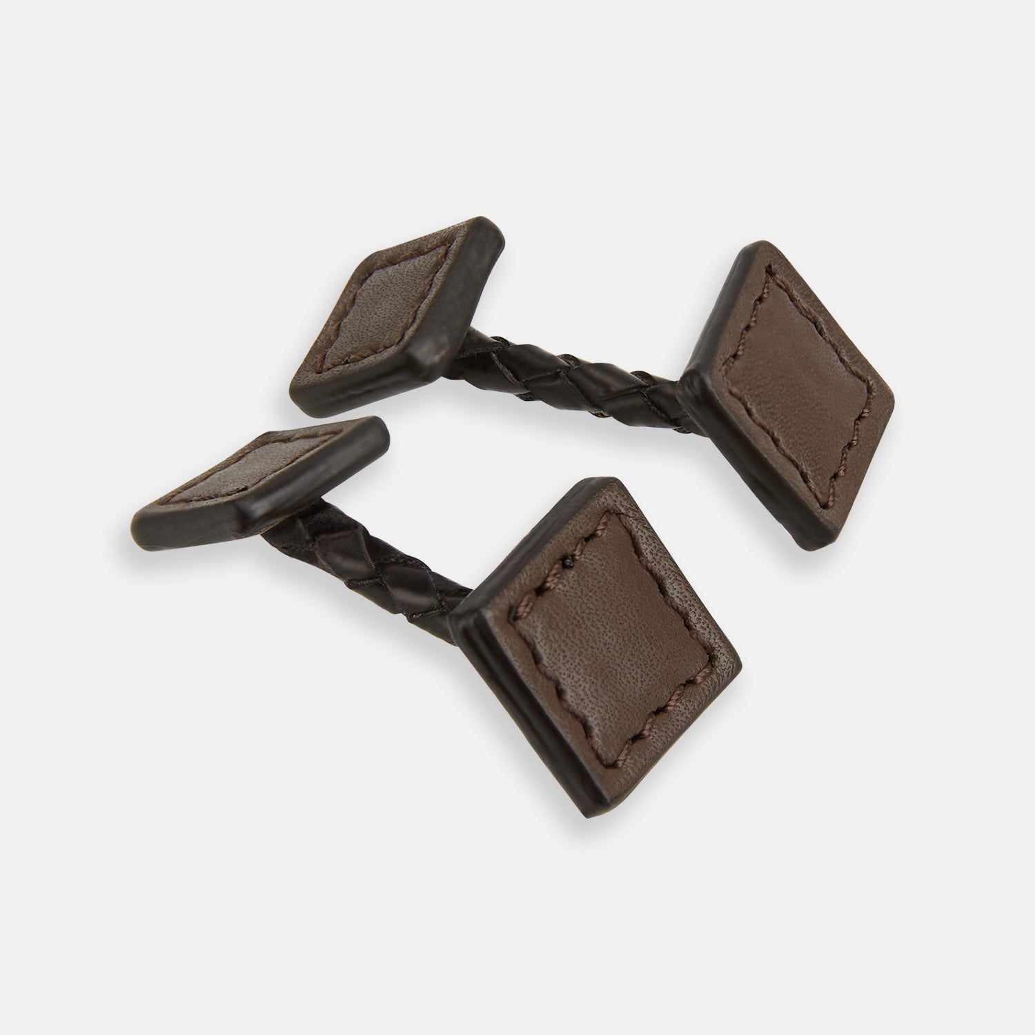 View 1 of product Turnbull & Asser’s Dark Chocolate Leather Cufflinks feature square Italian leather with stitched edges and braided links, perfect for men’s accessories, shown here on a white background.