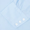 View 3 of product The Turnbull & Asser Light Blue Royal Oxford Cotton Shirt features a button-down collar, 3-button cuffs, and white buttons. Neatly folded with a visible inner label, it’s ideal to pair with a navy suit and displayed on a plain white background.