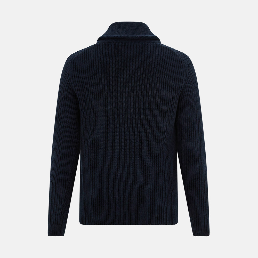 The Turnbull & Asser Midnight Blue Cashmere Shawl Collar Cardigan features ribbed fabric, five black front buttons, a shawl collar, and two front patch pockets, shown against a plain light background.