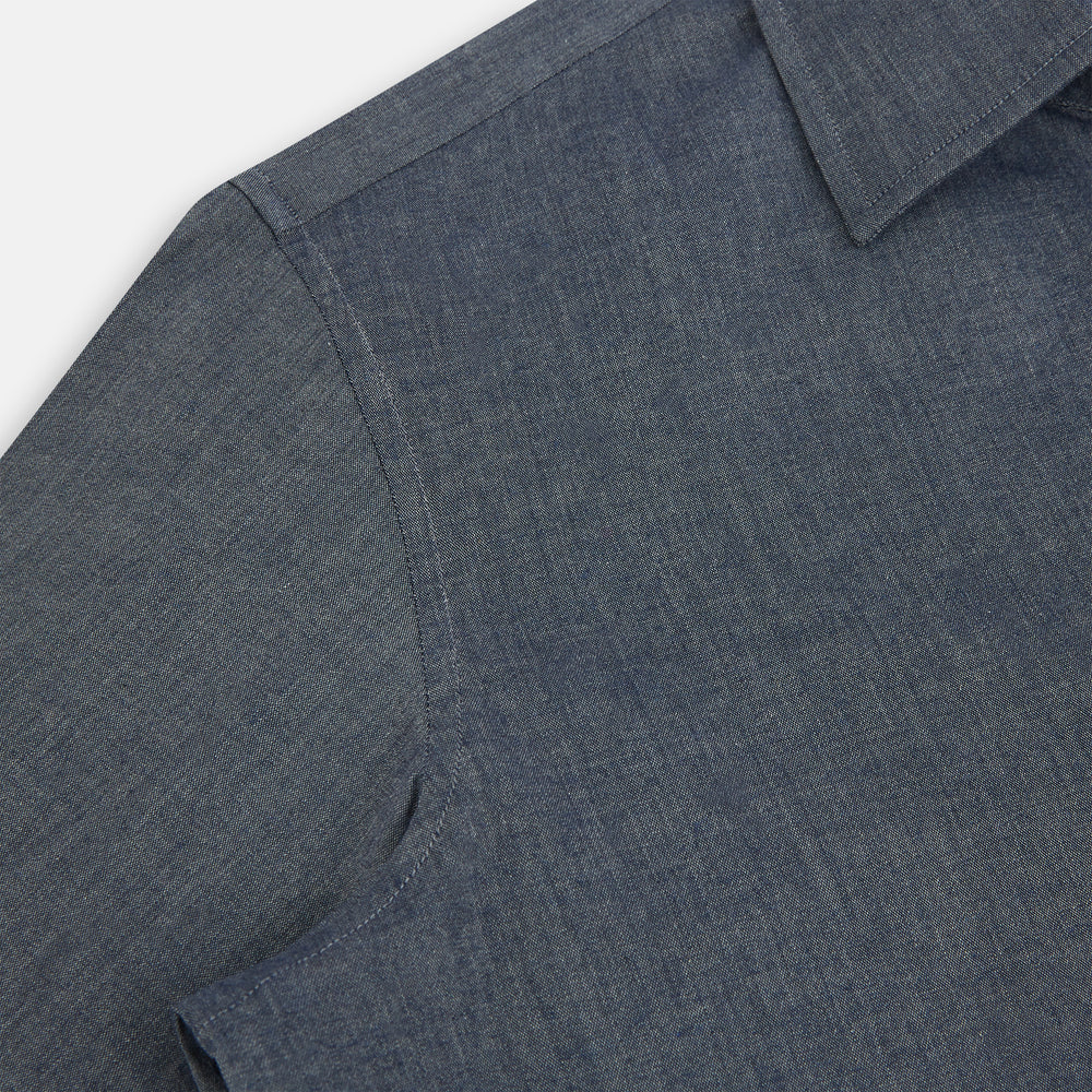 The Turnbull & Asser Azzurro Westminster Shirt in dark grey features long sleeves, a classic collar, buttoned cuffs, and a straight hem, showcased against a white background, highlighting refined British craftsmanship.