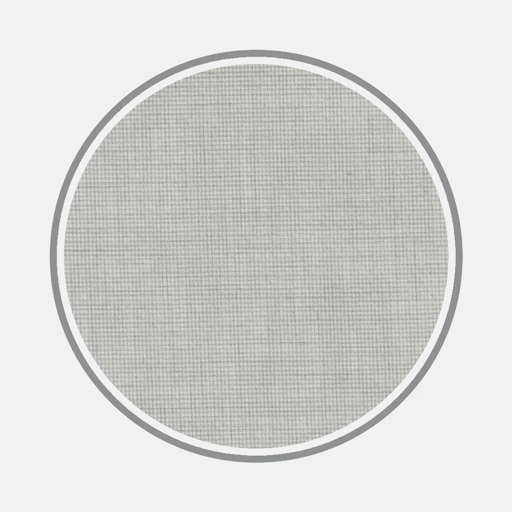 A circular mesh screen with a fine grid, framed by a thin gray ring on a white background, echoes the subtle detailing of Turnbull & Asser’s Bespoke Fabric 0124 31.