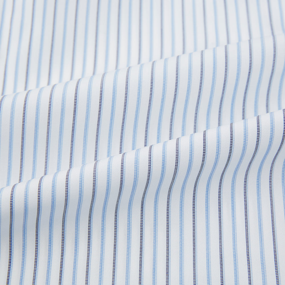 The Turnbull & Asser Navy and Blue Shadow Stripe Mayfair Shirt, featuring a classic T&A collar and buttoned cuffs, is laid flat on a white background.