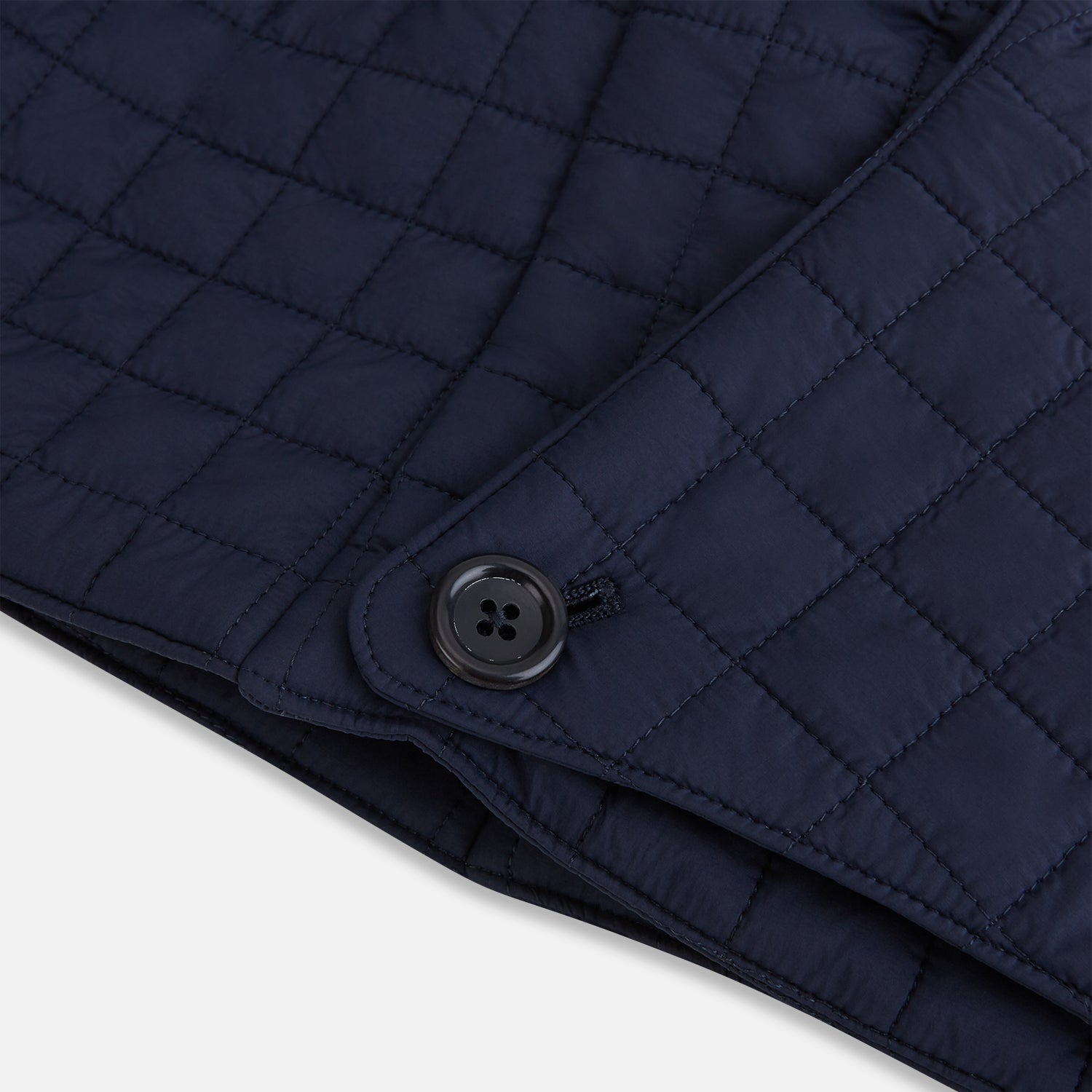 Image 5 of product The Turnbull & Asser Navy Quilted Hood with Neck Warmer features diamond pattern stitching, a structured hood, overlapping collar, and button closure, shown on a plain white background.