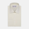 View 2 of product A close-up of Turnbull & Asser’s Cream Sea Island Quality Cotton Fabric is shown in a circular frame with a gray border, emphasizing its smooth texture and subtle stitching on the right side.