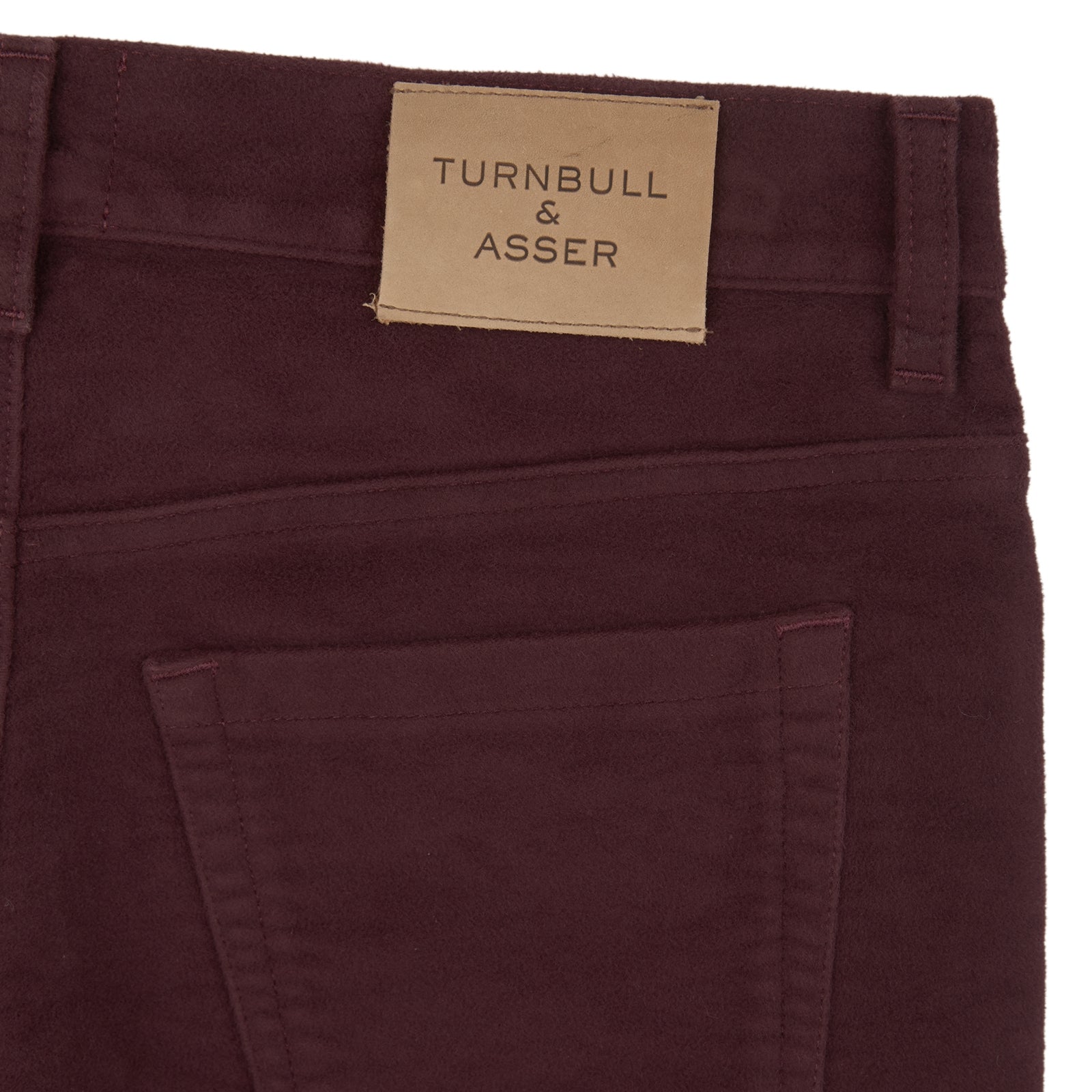 View 4 of product A pair of Purple 5 Pocket Jeans by Turnbull & Asser, featuring a straight-leg, high-waisted design with front and back pockets, displayed against a plain white background.