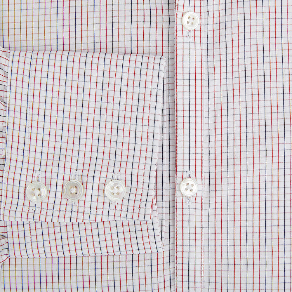 The Turnbull & Asser Red and Navy Check Windsor Shirt features a pointed collar and cuffed long sleeves, highlighting British craftsmanship. Displayed flat on a white background.