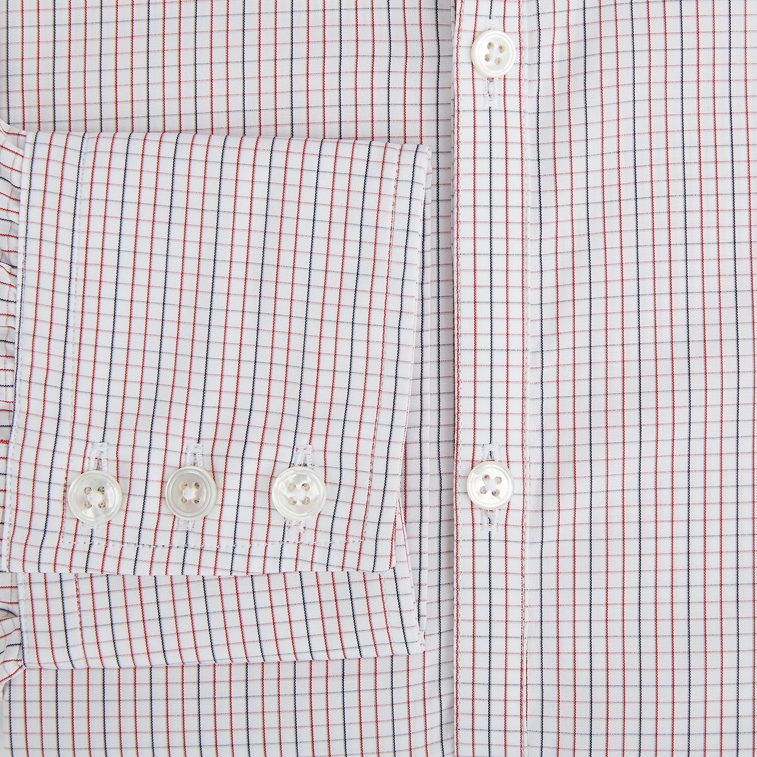 View 4 of product The Turnbull & Asser Red and Navy Check Windsor Shirt features a pointed collar and cuffed long sleeves, highlighting British craftsmanship. Displayed flat on a white background.