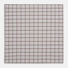 View 6 of product The Turnbull & Asser Hand Rolled Brown Overlay Check Handkerchief is a rectangular white cotton accessory with evenly spaced brown and black grid lines, forming squares—a timeless classic for gentlemen.