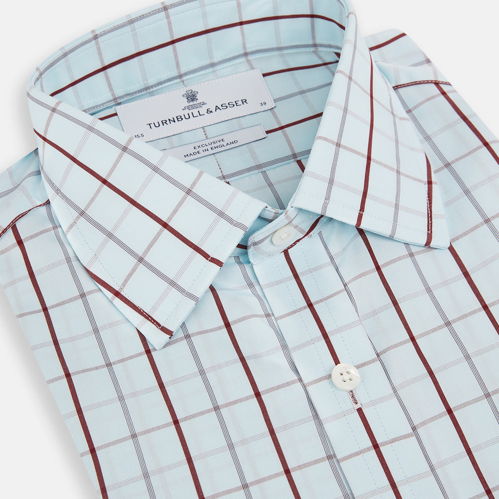 The Turnbull & Asser Burgundy Combination Check Mayfair Shirt is a long-sleeve button-up dress shirt with a check pattern, ideal for formal wear and shown on a plain white background.