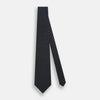 View 2 of product The Turnbull & Asser Green and Navy Micro Dot Silk Tie features small green dots on a navy silk background, displayed rolled up on white.